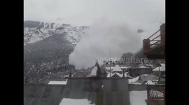 Avalanche rumbles by mountain village in north India