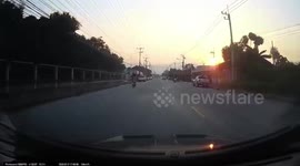 Shocking moment driver opens door into path of motorcycle rider knocking her into road