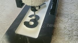 Watching this computer-controlled machine carve numbers into a plaque is deeply satisfying