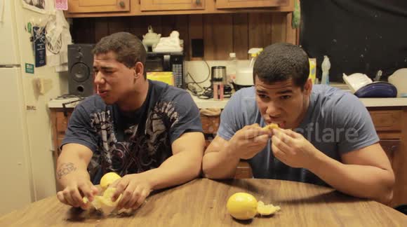 US identical twins attempt to eat two unpeeled lemons in bittersweet competition