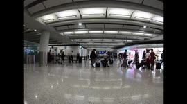 Airport officers carry out temperature checks on children at Hong Kong airport