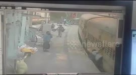 Moment Indian police official saves passenger falling from departing train