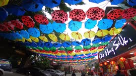 Thousands of colourful umbrellas hang over 'Silk Street' in Vietnam