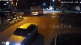 Thai driver stuck on level crossing battles to free car before train smashes into it