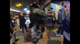 Riot police point pepper spray on residents and journalists to push them back in Mongkok