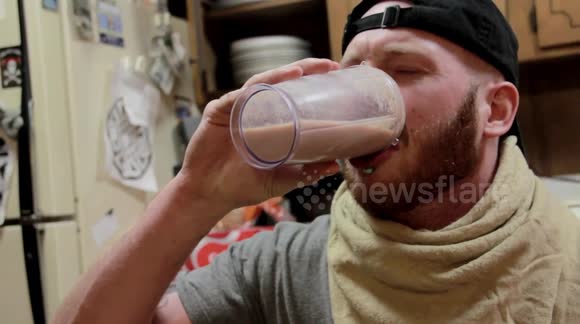 Man Drinks An Insect and Hotdog Milkshake