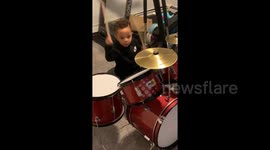This is what happiness looks like: Music-mad 2-year-old boy gets new drum kit from mom