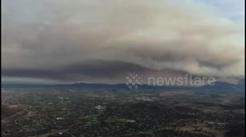 Drone footage shows skyline filled with smoke after fires ravage landscape near Canberra