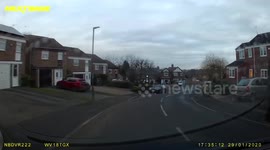 Car enters road on the wrong side