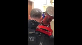 UK police officers use battering ram to break colleague out of locked toilet