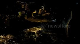 Dangerous flood causes damages to streets and cars in Colombia