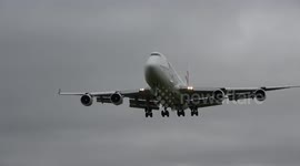 Britons wearing surgical masks leave plane at RAF Brize Norton