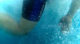 This video showes an interracial couple, swimming with wild whale sharks. The location is in Gorontalo (Indonesia).