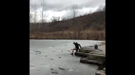 Man trying to step out onto an icy lake