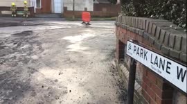 Residents flee their homes in the early hours after a burst water main floods 100 properties