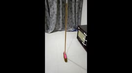 Viral standing broom trick sweeping the internet