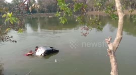 Car rolls into pond after driver leaves without pulling handbrake in Thailand