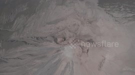 Chile's Santiaguito volcano lets out small plumes of ash