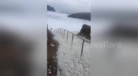 Storm Dennis whips up sea foam on Irish coast