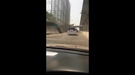 Truck topples over on sharp bend while being chased by police (original)