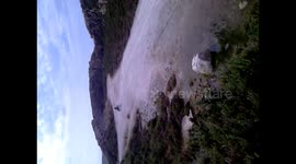 Falling off motorbike rolls into puddle