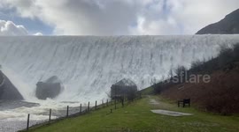 Gallons of water pours from overflowing Welsh dam after Storm Dennis rainfall