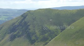 HM Coastguard flying through the Mach Loop