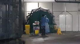Staff at London hospital seen going through 'coronavirus assessment area' in ambulance parking bay