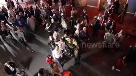 Mardi Gras from a balcony throwing beads