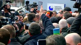 Georgia's former Prime Minister surrounded by journalists as he leaves prison