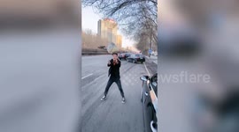 Restaurant owner in China throws takeaway food to customers to avoid the spread of coronavirus