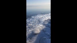 Ice piles up on shoreline