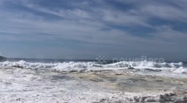 Expert jet ski drivers aiding surfers during Big Wave Season, Nazaré, Portugal