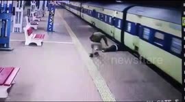 Indian police officer rescues man who slipped boarding moving train