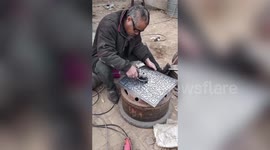 Chinese welder creates QR linking to his social media on metal plate