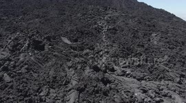 Tourists walk on lava to grill marshmallow on Pacaya.