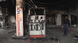 Buildings and vehicles charred after violence in New Delhi leaves 34 dead