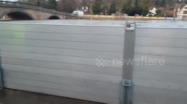 River Severn high level up against flood barriers at Bewdley