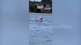 UK dad filmed swimming in four-foot deep floodwater after being dared to by friends