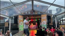 A man sings Whitney Houston