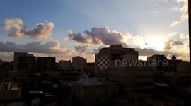 Sunrise amid a flow of smooth clouds in the blue sky