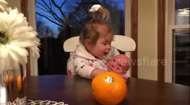 Her Face! Baby Pulls Face When She Drops Orange.