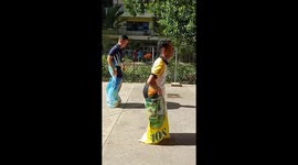 Hilarious moment Filipino student uses cartwheel hack to win sack race at school sports day