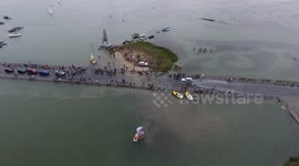 Cars stuck on high tide while watching boat race in Essex