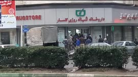 Iranians gather in long pharmacy line as coronavirus fear mounts