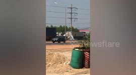Truck Belches Grey Fumes On Roadside