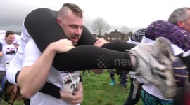 Bizarre! Annual wife-carrying contest takes place in the UK