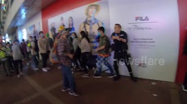 Tense moment isolated Hong Kong police officer points gun as he is surrounded by protesters