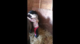 Tiny 4 year old mounts her pony unaided.