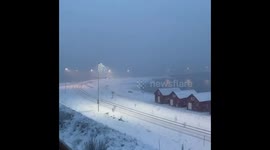 Heavy snow falls across Norwegian port